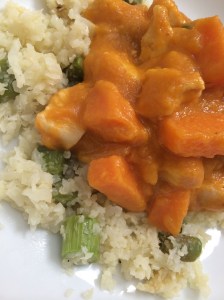 Paleo/Whole 30 Thai pumpkin curry with chicken over asparagus cauliflower rice.